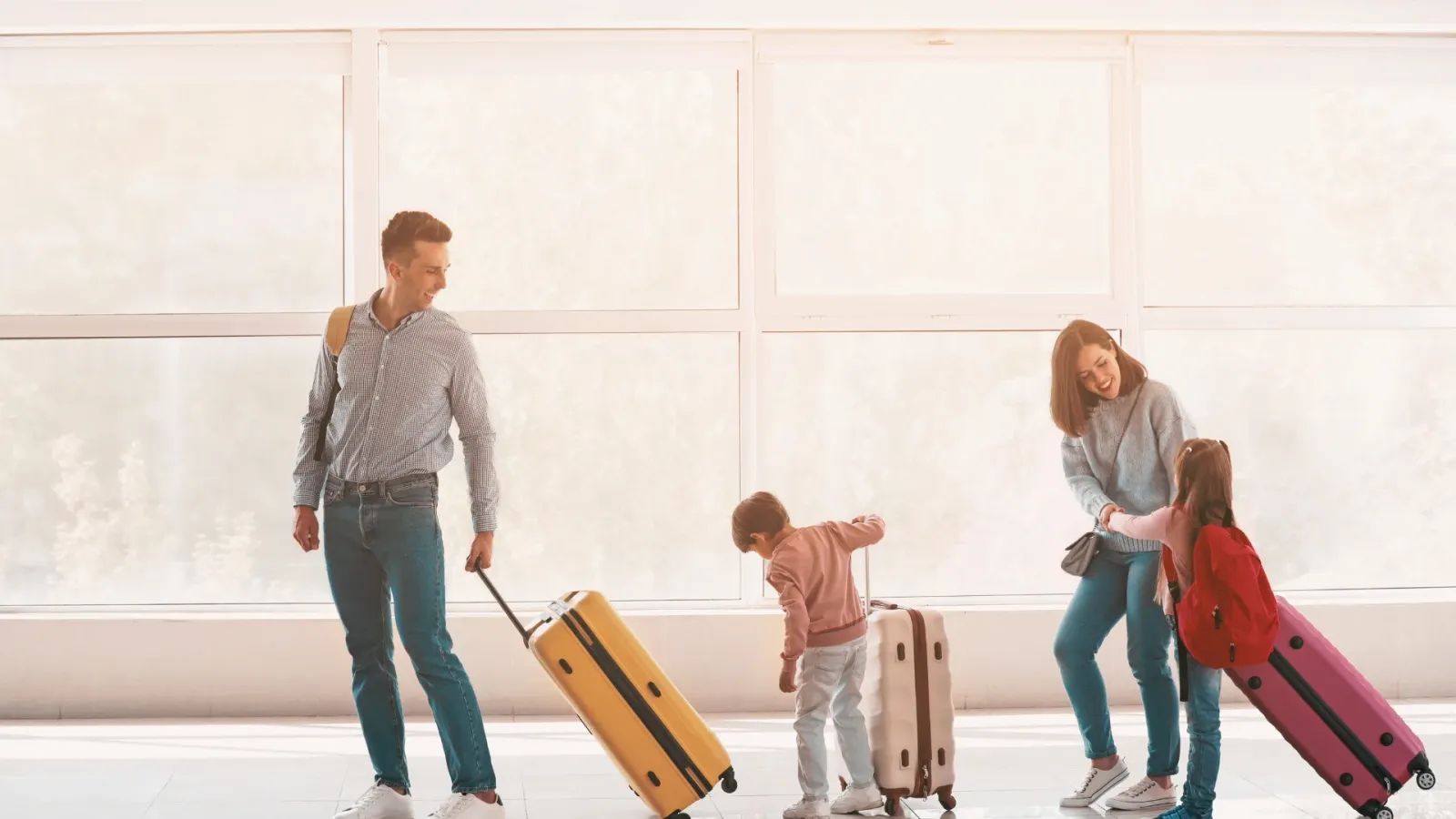 a man woman and child with luggage