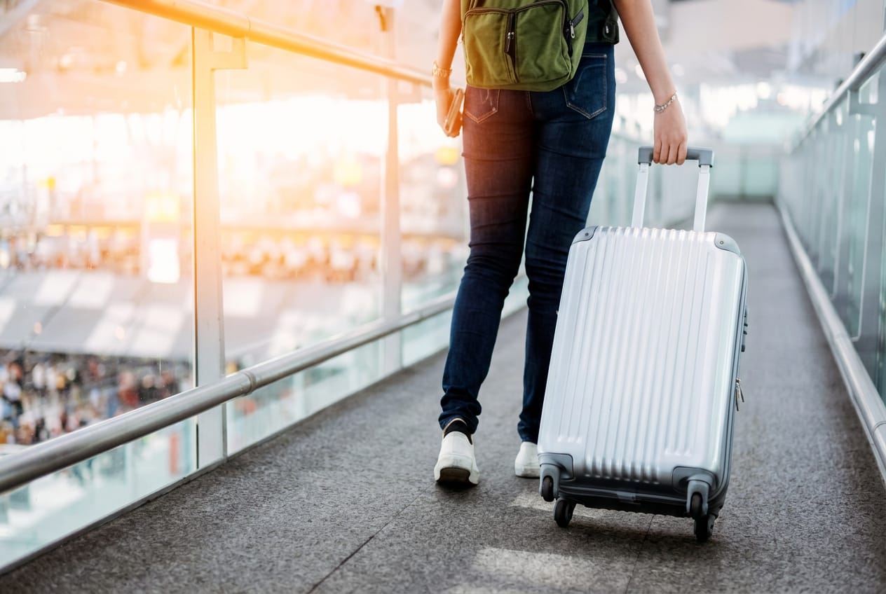 Traveler dropping off luggage at Flexy Luggage Corfu Airport storage